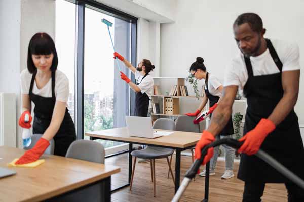 Columbus High-Rise office cleaners and janitorial service also serving Cincinnati & Cleveland hi-rise buildings showing cleaning crew hard at work in a building office.
