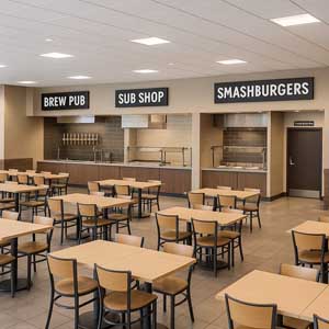 Food hall cleaning, food court janitorial, and cafeteria cleaning services in Ohio showing a food hall with a Brew Pub, Sub Shop, Smashburgers, and a restroom.
